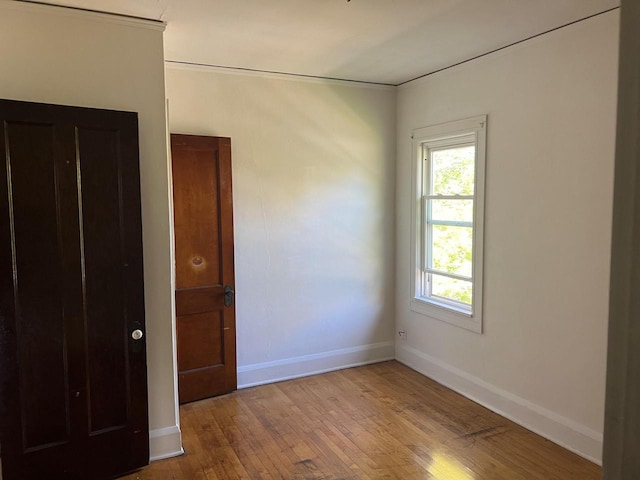 spare room featuring light hardwood / wood-style flooring