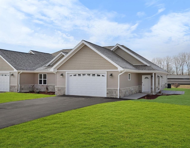 view of front of home with a garage and a front yard