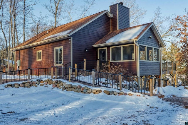 view of front of house featuring a sunroom