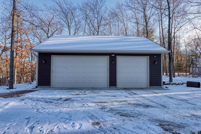 view of snow covered garage