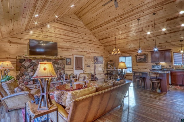 living room featuring high vaulted ceiling, dark hardwood / wood-style floors, wooden walls, and wood ceiling