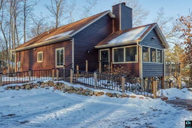 view of front of house featuring a sunroom