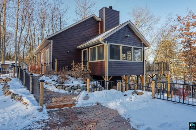 view of front of house with a sunroom