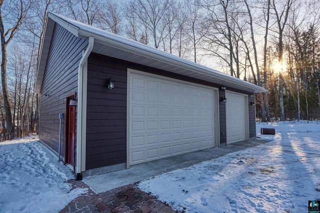 view of snow covered garage