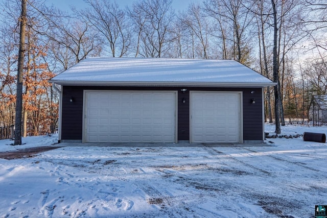 view of snow covered garage