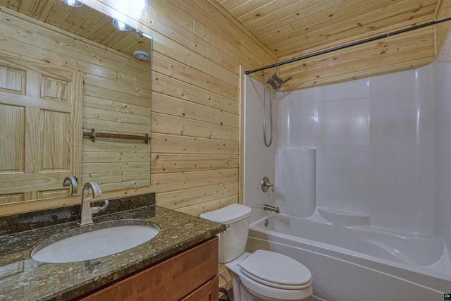 full bathroom with toilet, wood walls, wood ceiling, shower / washtub combination, and vanity