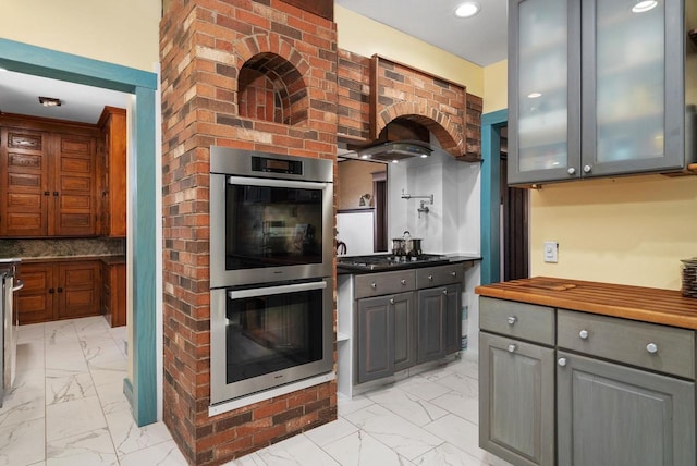 kitchen with gray cabinets and appliances with stainless steel finishes