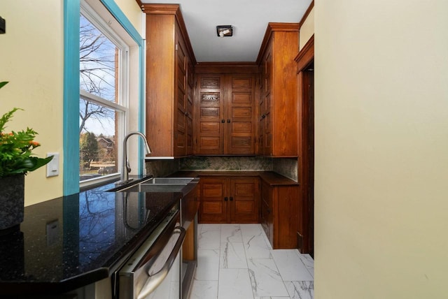 kitchen featuring tasteful backsplash, sink, dark stone countertops, dishwashing machine, and kitchen peninsula