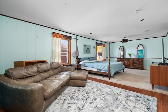 bedroom featuring crown molding and hardwood / wood-style floors