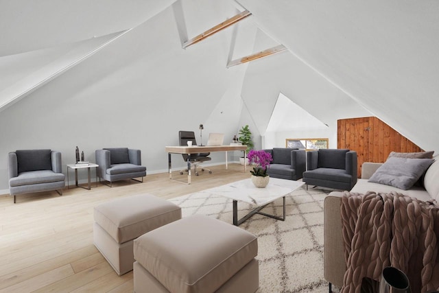 living room featuring lofted ceiling and light wood-type flooring