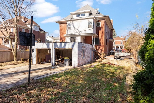 back of house with a patio