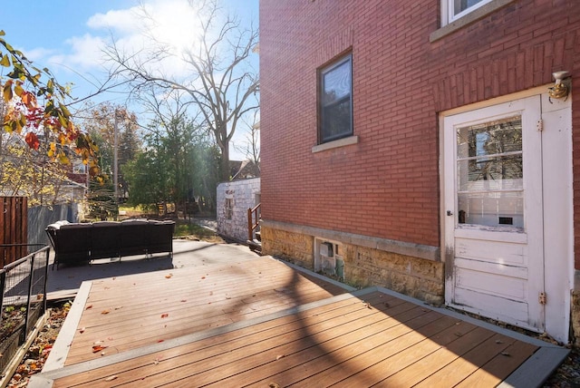 wooden deck featuring outdoor lounge area