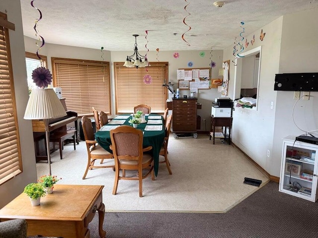 dining room with a textured ceiling