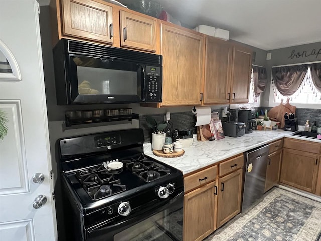 kitchen with backsplash and black appliances