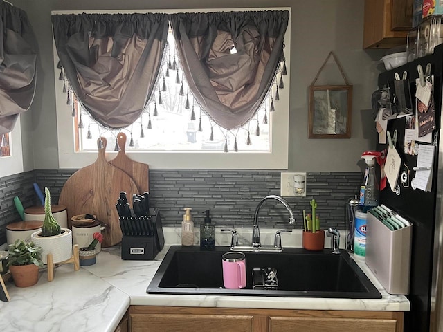 kitchen with sink and backsplash