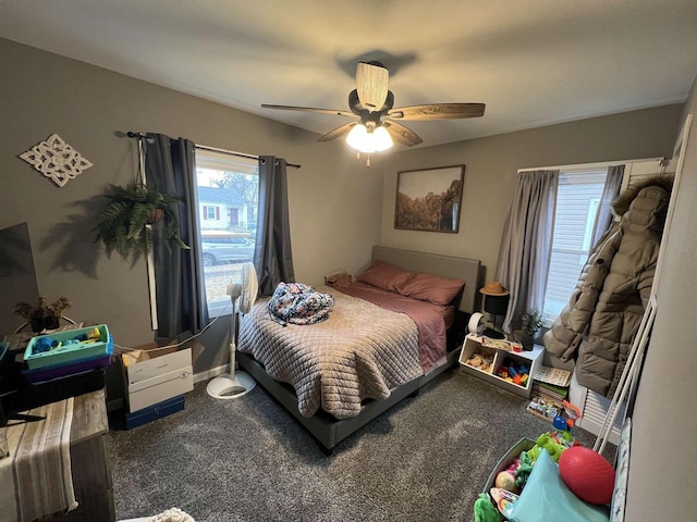 bedroom featuring ceiling fan and carpet floors