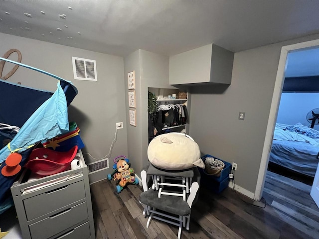 game room featuring dark wood-type flooring