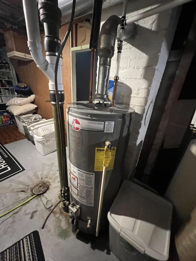 utility room featuring water heater