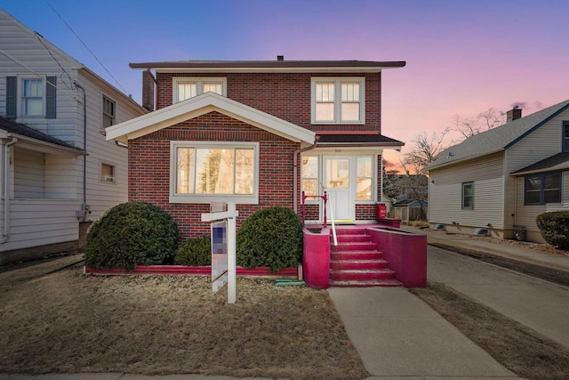 traditional-style house with brick siding