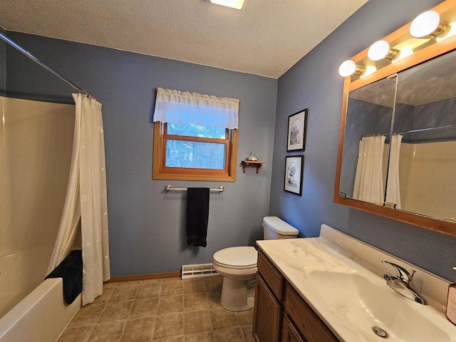 full bathroom with shower / tub combo with curtain, vanity, toilet, and a textured ceiling