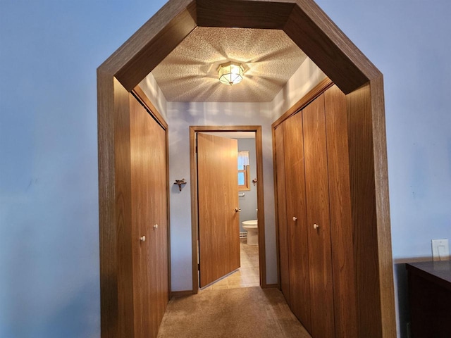 hallway with light carpet