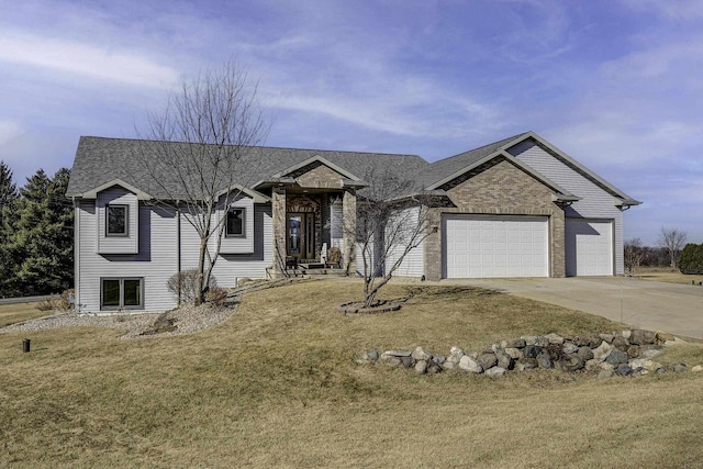 view of front of house featuring a garage and a front lawn