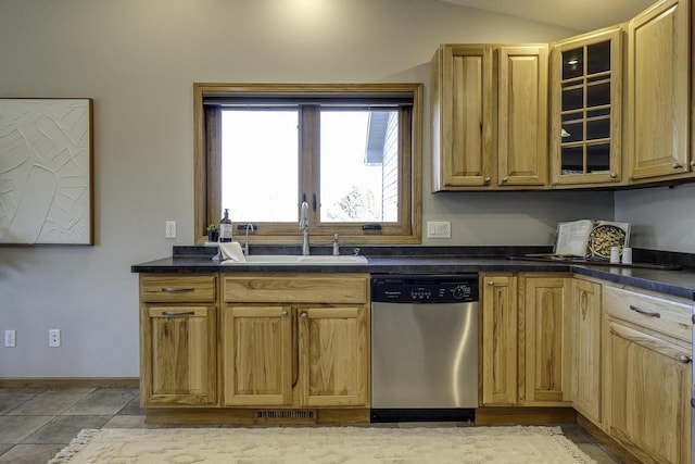 kitchen with dishwasher, vaulted ceiling, and sink