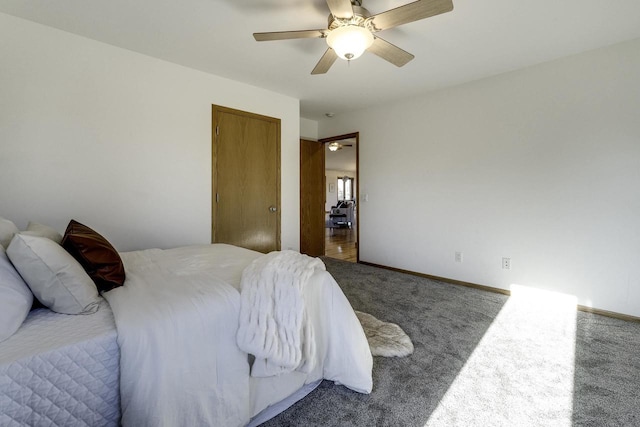 carpeted bedroom with ceiling fan and a closet