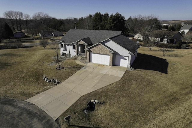 view of front of property featuring a garage and a front yard