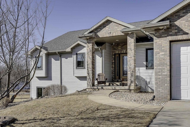 view of front of property featuring a garage and covered porch