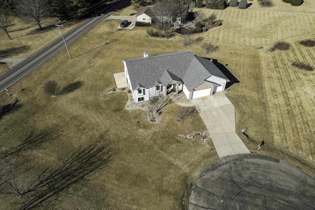 birds eye view of property with a rural view