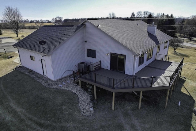 rear view of house featuring a deck