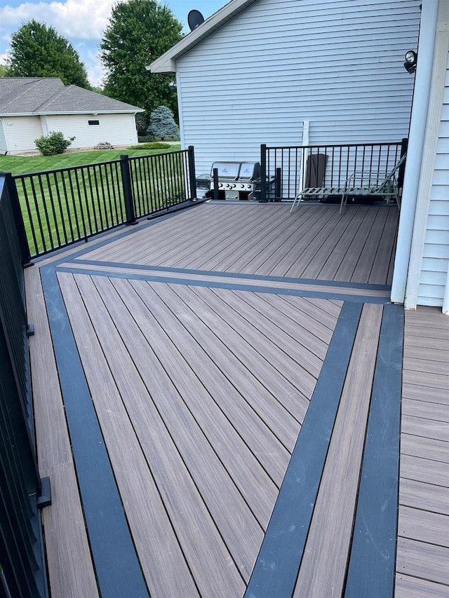 wooden deck with a yard