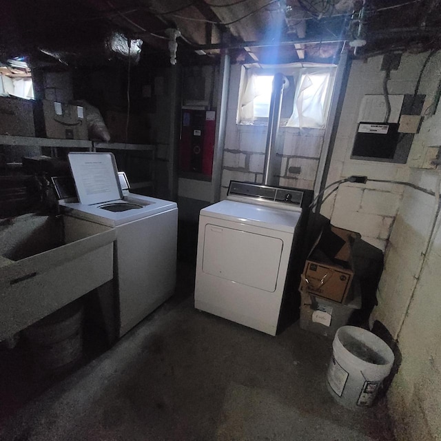 laundry area featuring a healthy amount of sunlight and washer and dryer