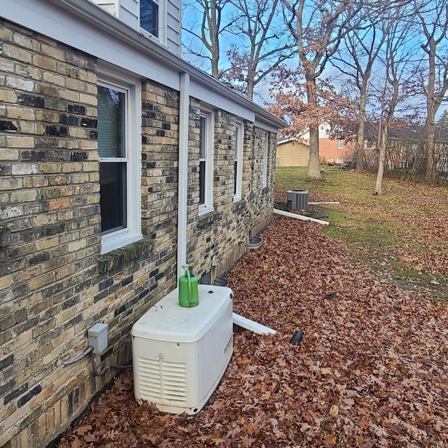 view of side of property featuring central AC unit