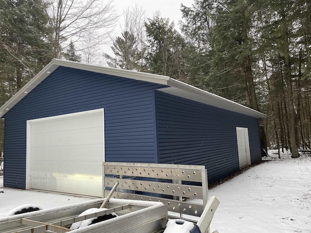 view of snow covered garage