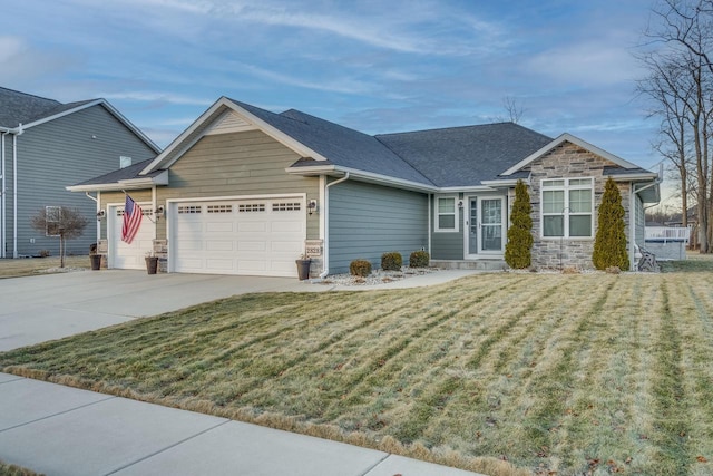 view of front of home with a garage and a front yard