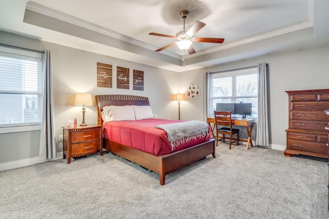 carpeted bedroom with crown molding, a raised ceiling, and ceiling fan