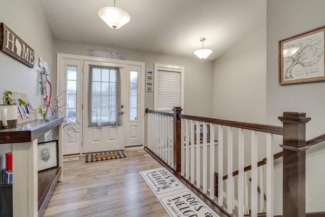 entryway with light hardwood / wood-style flooring