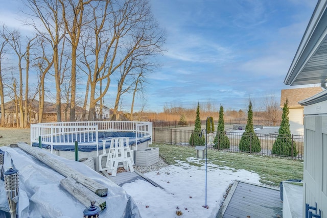 yard covered in snow with a covered pool