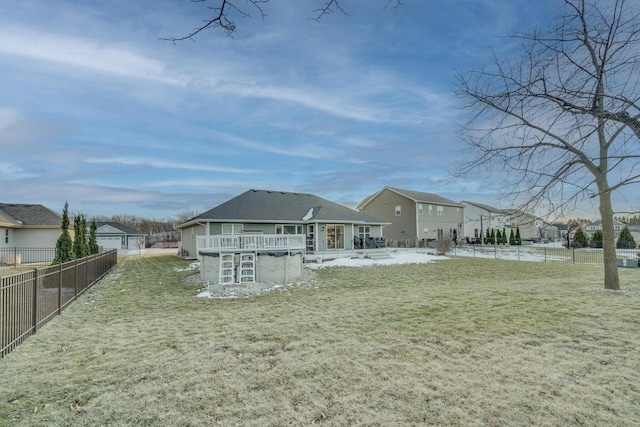 rear view of property featuring a yard