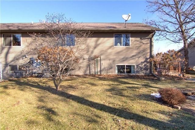 back of house featuring a yard