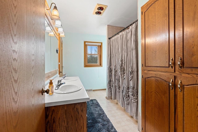 bathroom featuring vanity and a shower with curtain