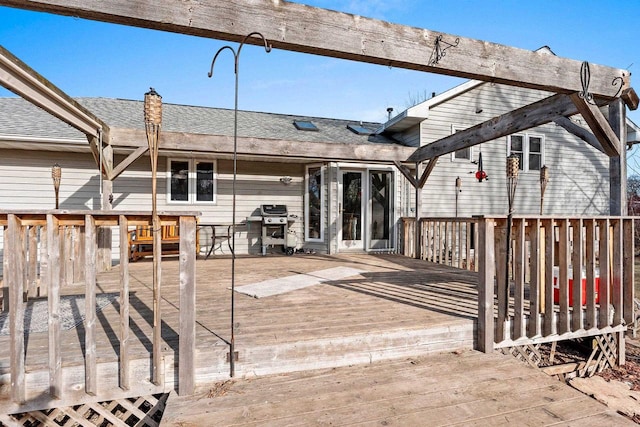 back of property with a wooden deck