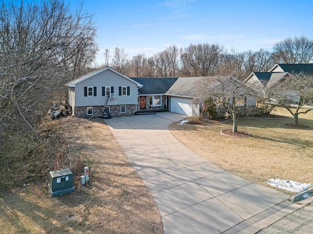 view of front of property with a garage and a front lawn