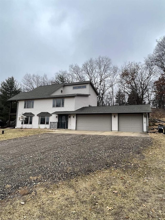 view of front of property with a garage