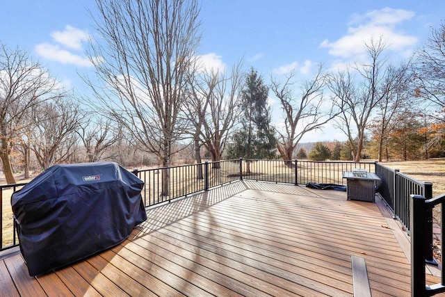 wooden deck featuring area for grilling