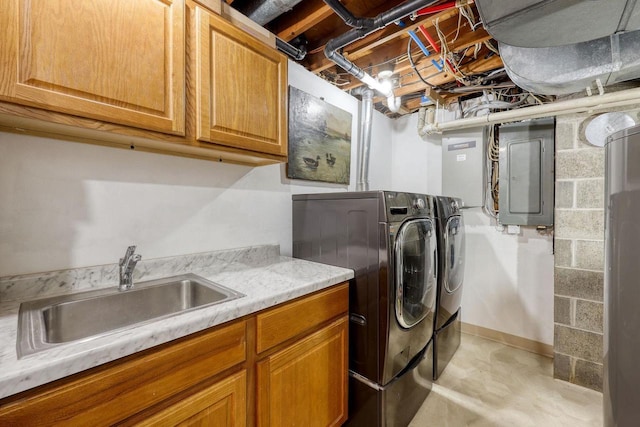 laundry area featuring cabinets, washer and dryer, sink, and electric panel