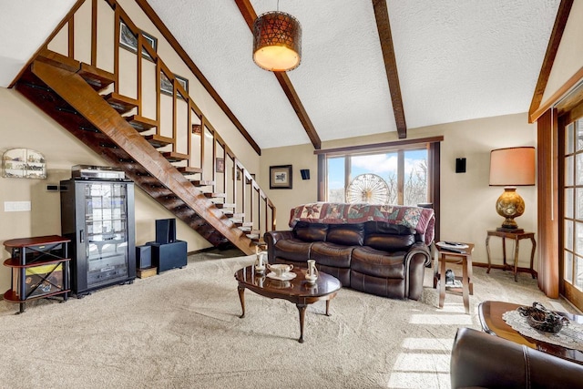 living room featuring carpet floors, lofted ceiling with beams, and a textured ceiling