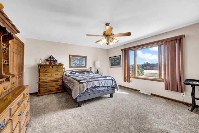 bedroom featuring ceiling fan and dark colored carpet